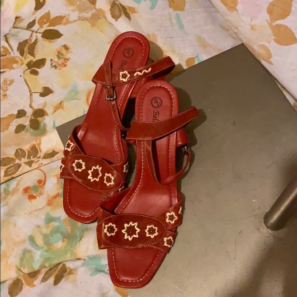 Red leather sandal with floral detail